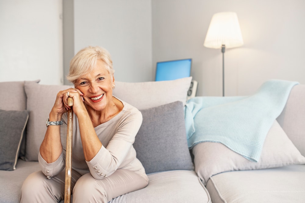 Elderly,Woman,With,Walking,Stick,At,Home.,Caucasian,Female,Looking